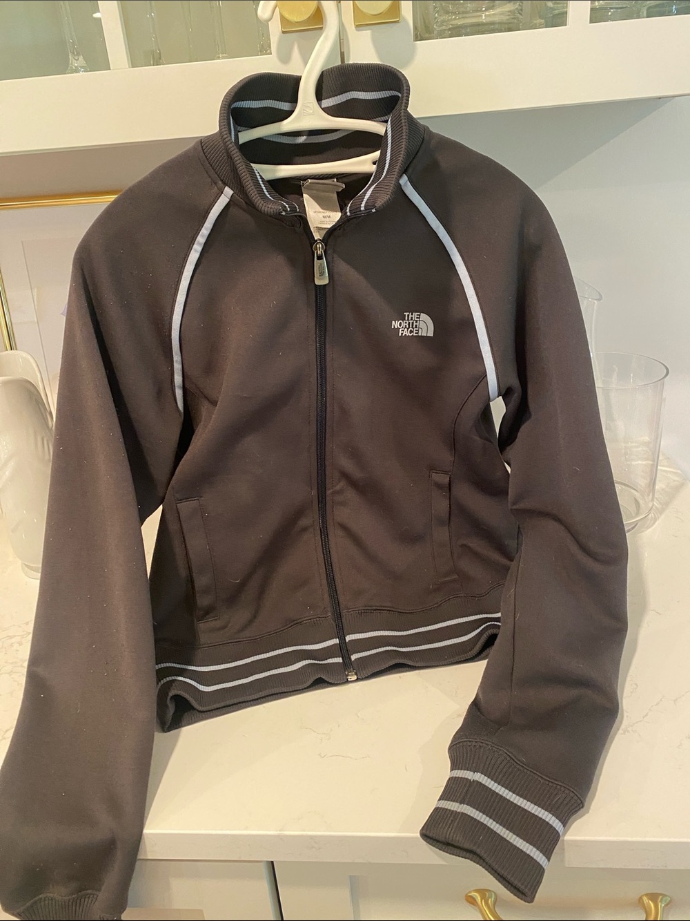The North Face Women’s size MediumNavy Blue Full-Zip Jacket with light blue Trim